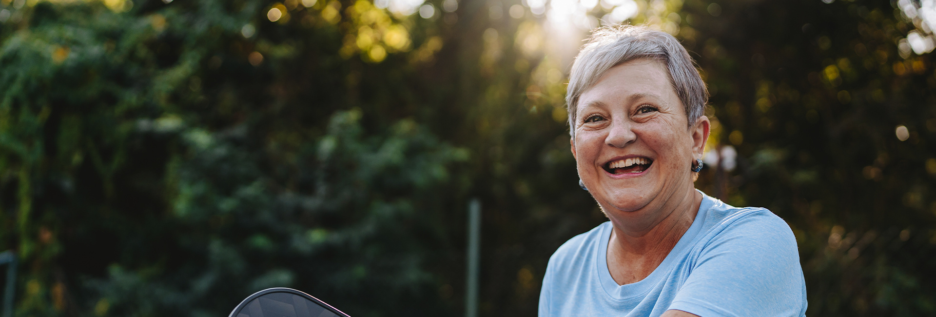 Woman enjoys a games of pickleball. 