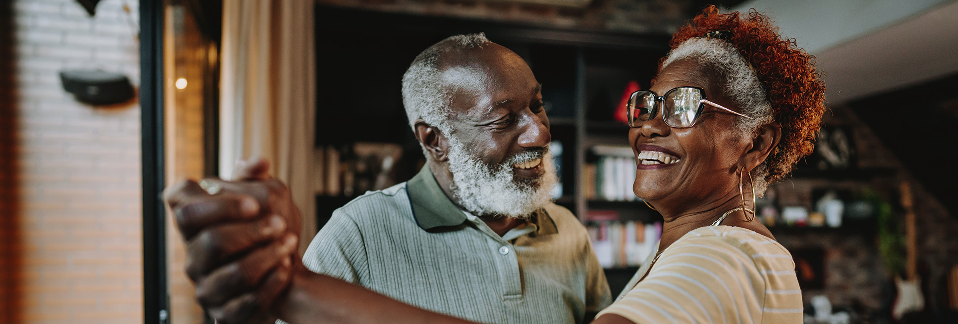Older couple enjoys a dance together. 