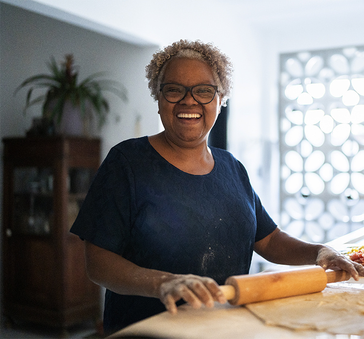 Woman enjoys baking in her apartment. 