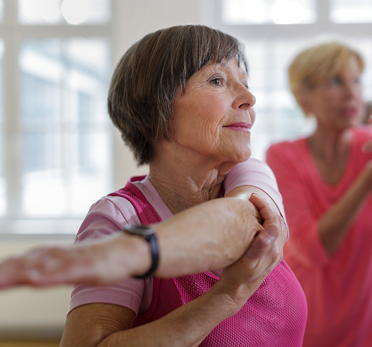 Older woman in a fitness class. 