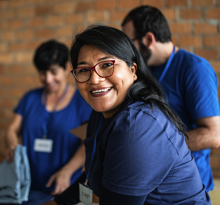 Smiling fundraiser volunteers. 