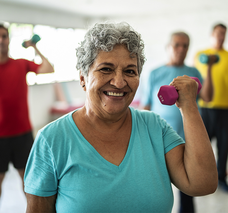 Older woman in a fitness class. 