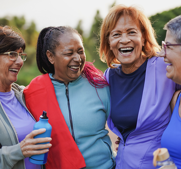 Group of active seniors enjoy a moment on their walk. 