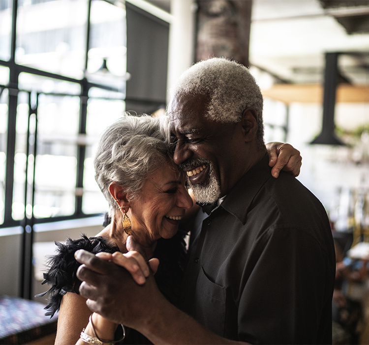 A senior couple dancing together. 