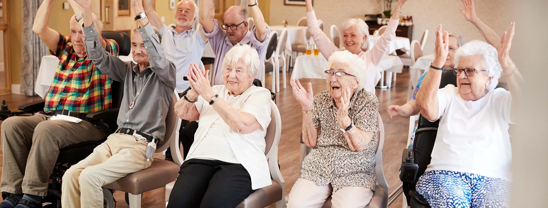 group of senior men and women clapping and having fun