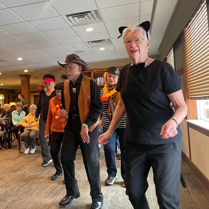 seniors dancing in Halloween costumes lifelong learning the ebenezer difference